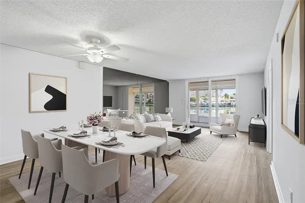 a view of a dining room with furniture window and wooden floor