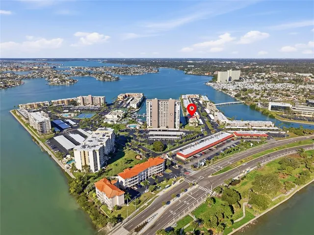 an aerial view of a house yard swimming pool and outdoor seating