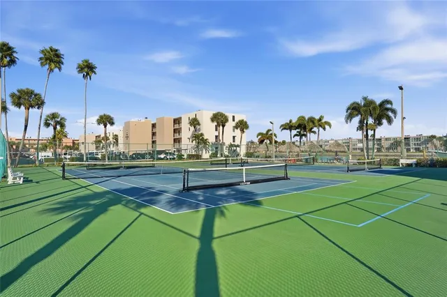 a view of an outdoor space and tennis court