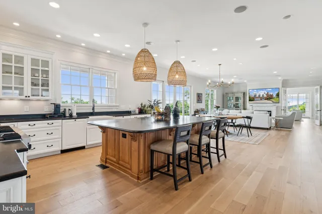 a living room with furniture and kitchen view