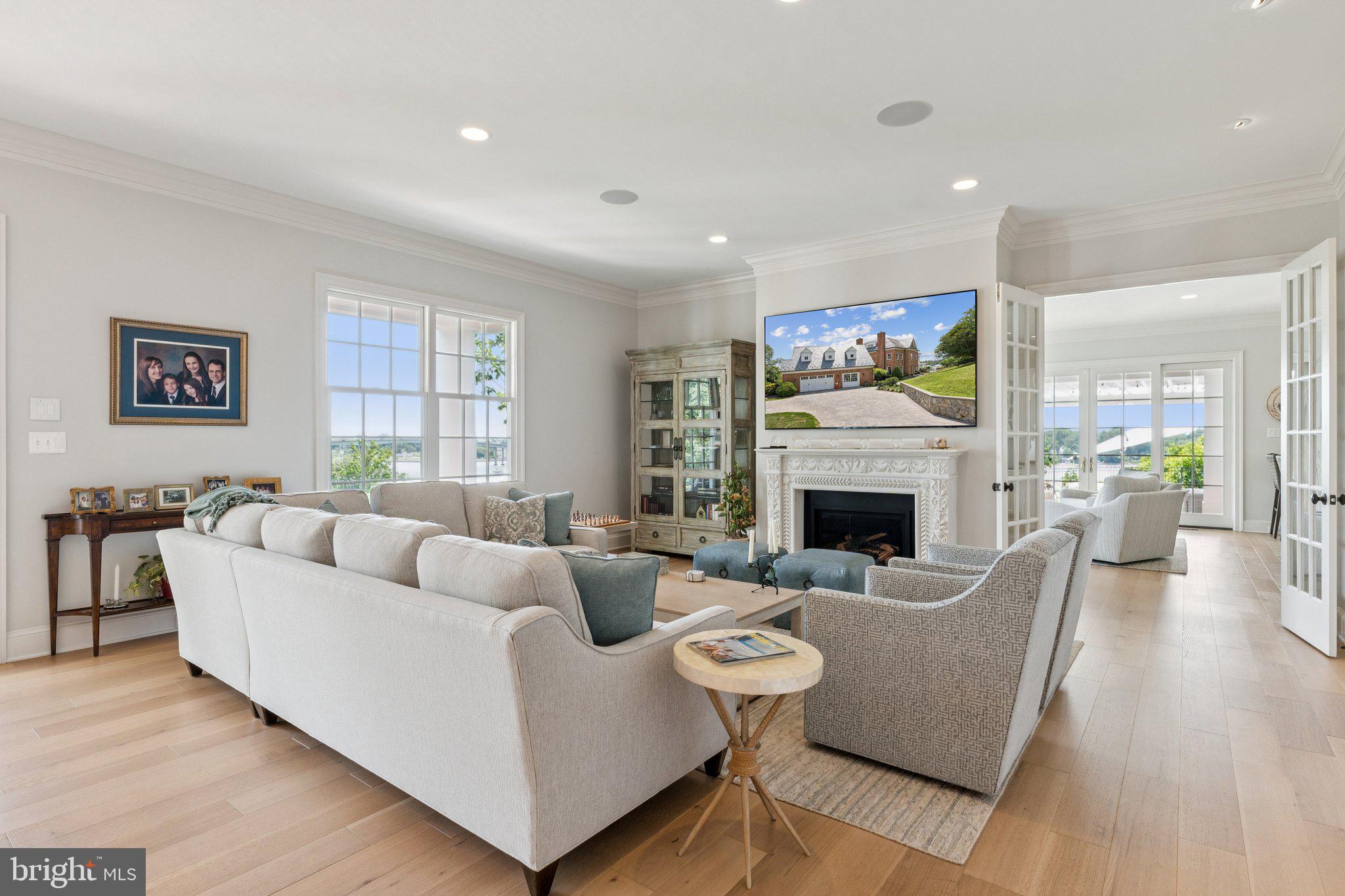 1932 Carrollton Road Annapolis, MD 21409 - Photo 17 of 85 a living room with furniture a fireplace and a flat screen tv