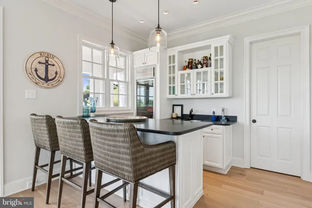 a spacious bathroom with a granite countertop sink a mirror and shower