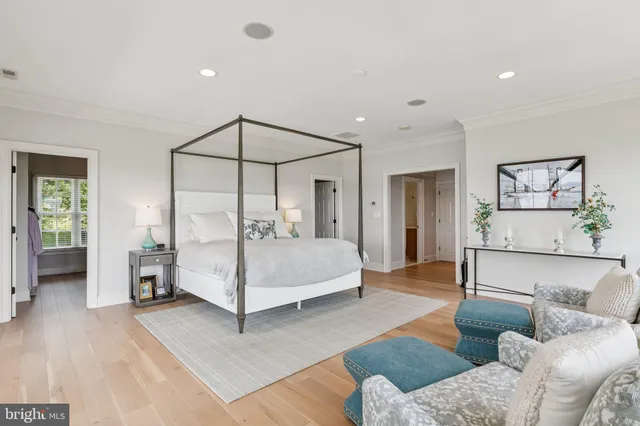 a bedroom with a bed and a car