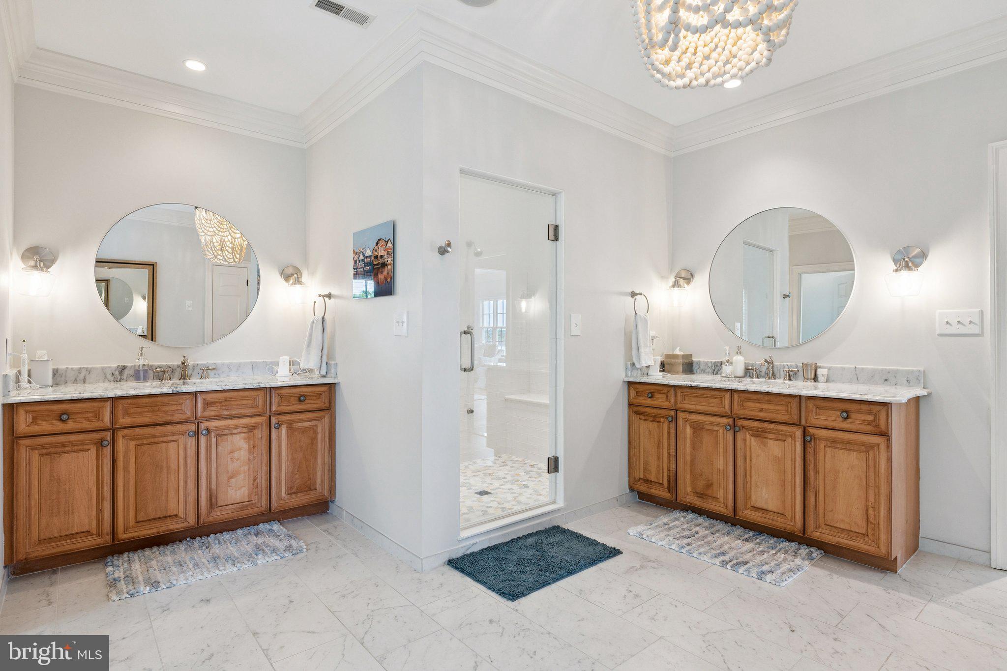 1932 Carrollton Road Annapolis, MD 21409 - Photo 37 of 85 a spacious bathroom with a granite countertop sink a mirror and shower