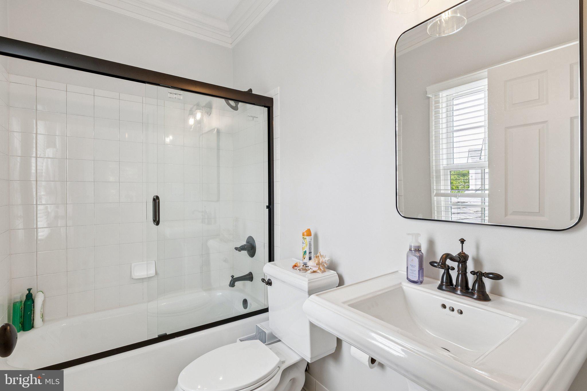 1932 Carrollton Road Annapolis, MD 21409 - Photo 50 of 85 a bathroom with a sink toilet and shower