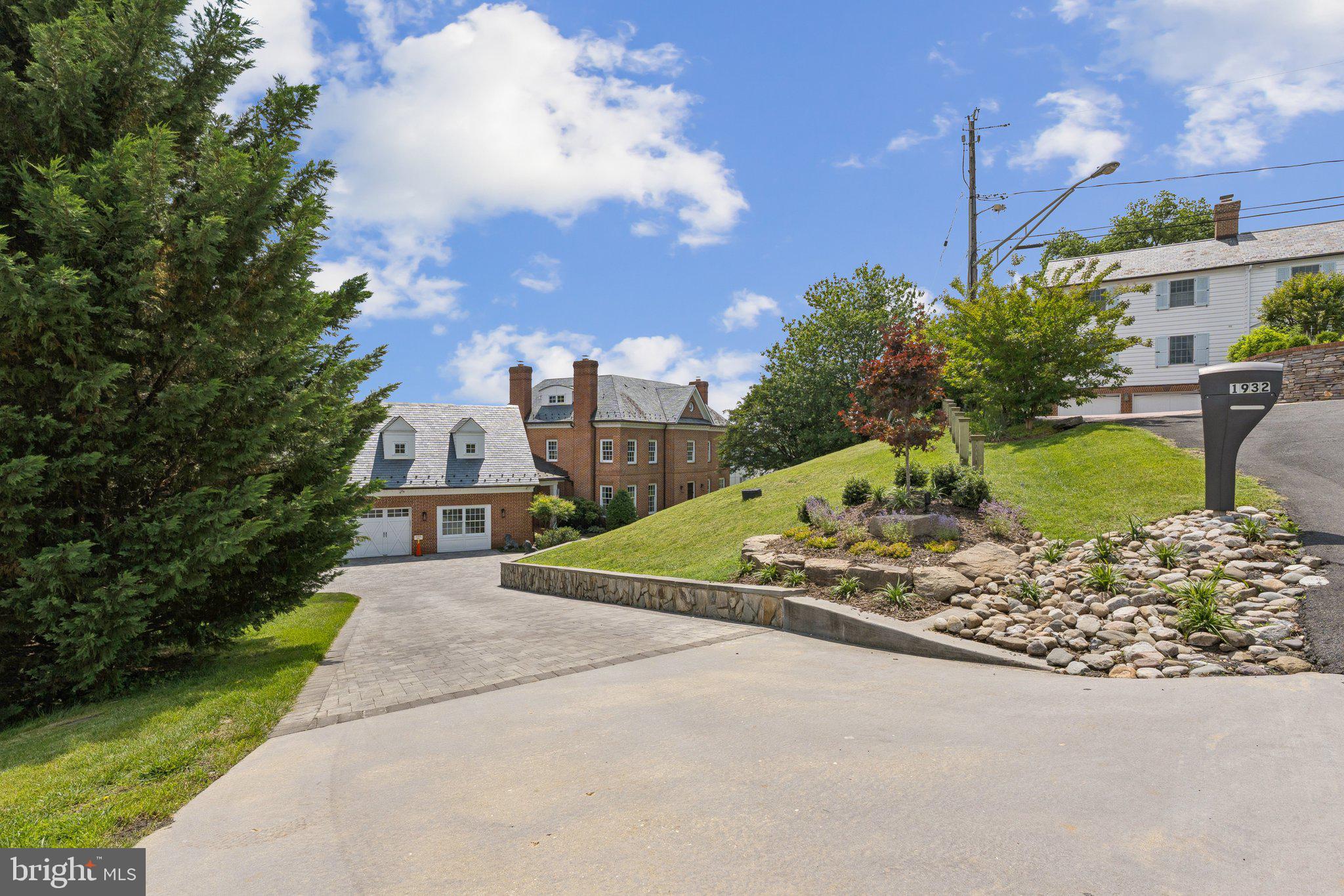 1932 Carrollton Road Annapolis, MD 21409 - Photo 63 of 85 a front view of a house with a yard and garage