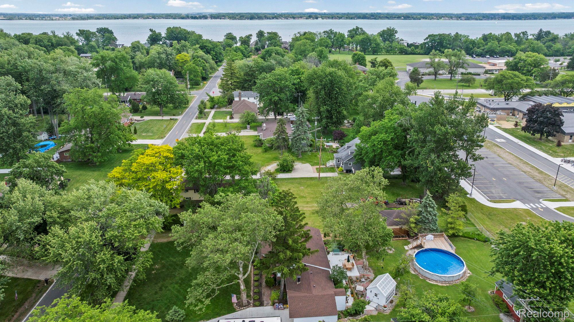 7993 Church Road Grosse Ile, MI 48138 - Photo 30 of 37 Aerial perspective showcasing residential properties with a visible body of water in the background