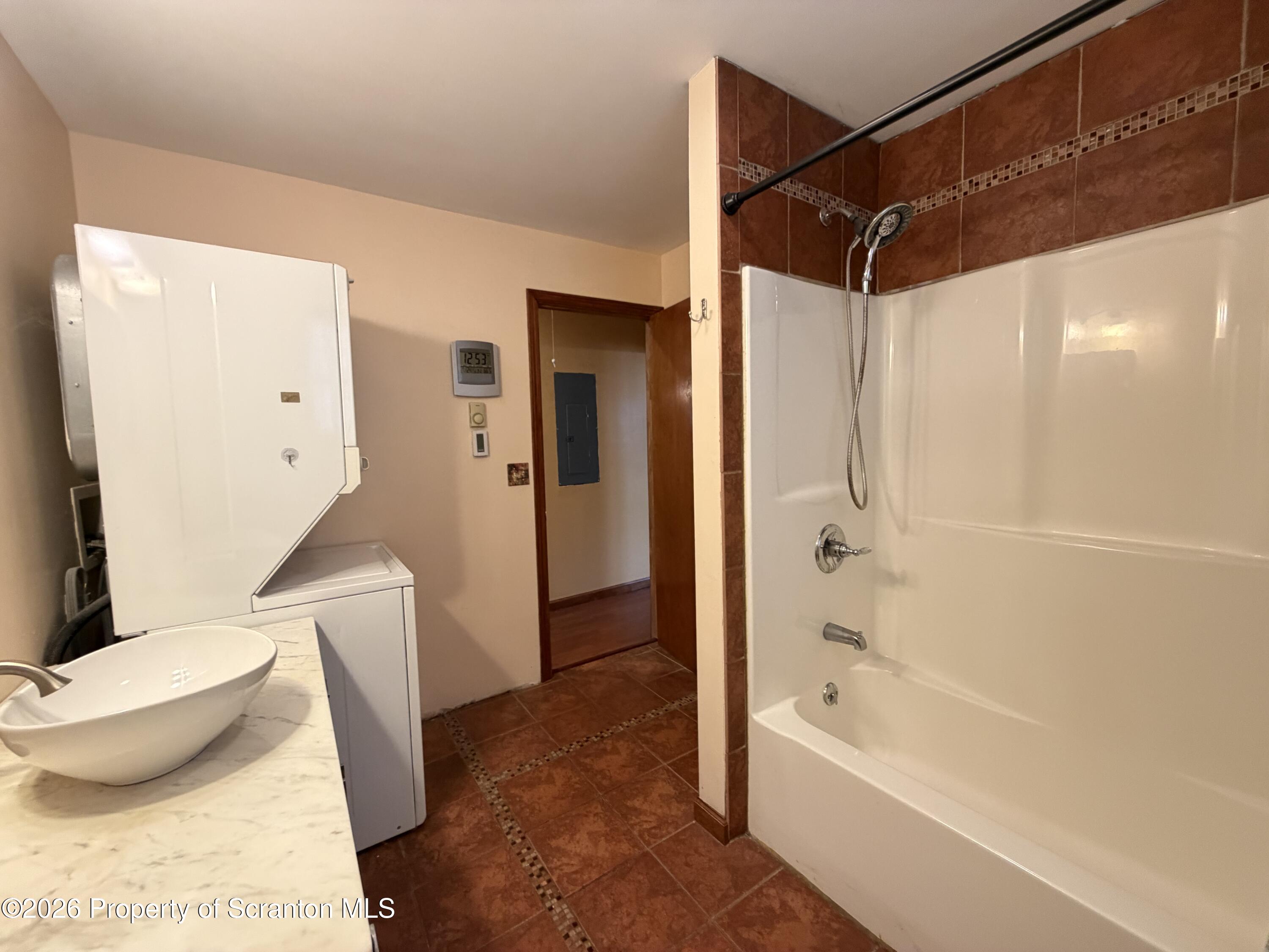 1019 Moosic Street Scranton, PA 18505 - Photo 22 of 43 a bathroom with a toilet and a bathtub