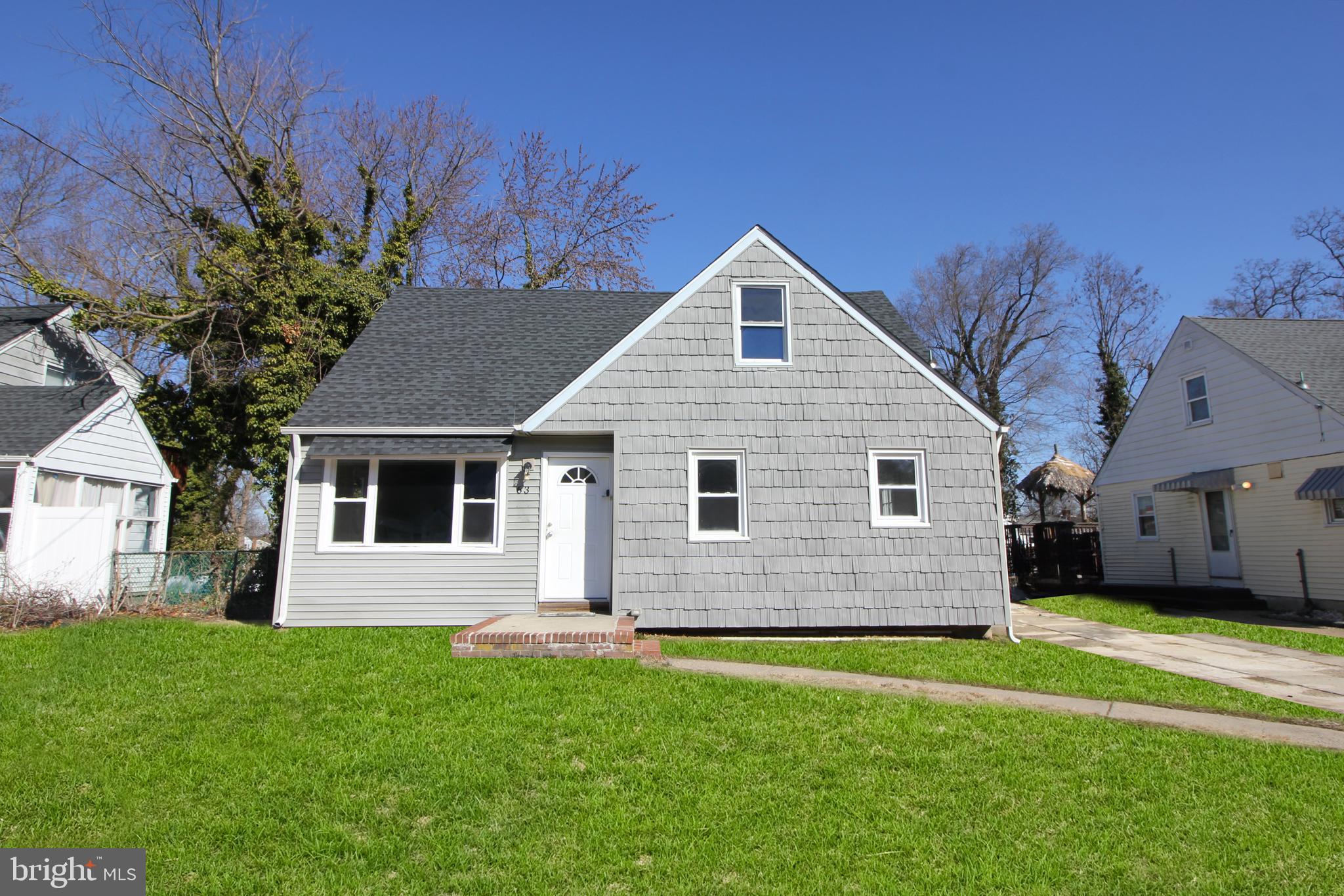 63 Ridgley Street Mount Holly, NJ 08060 - Photo 1 of 30 a front view of house with yard and green space
