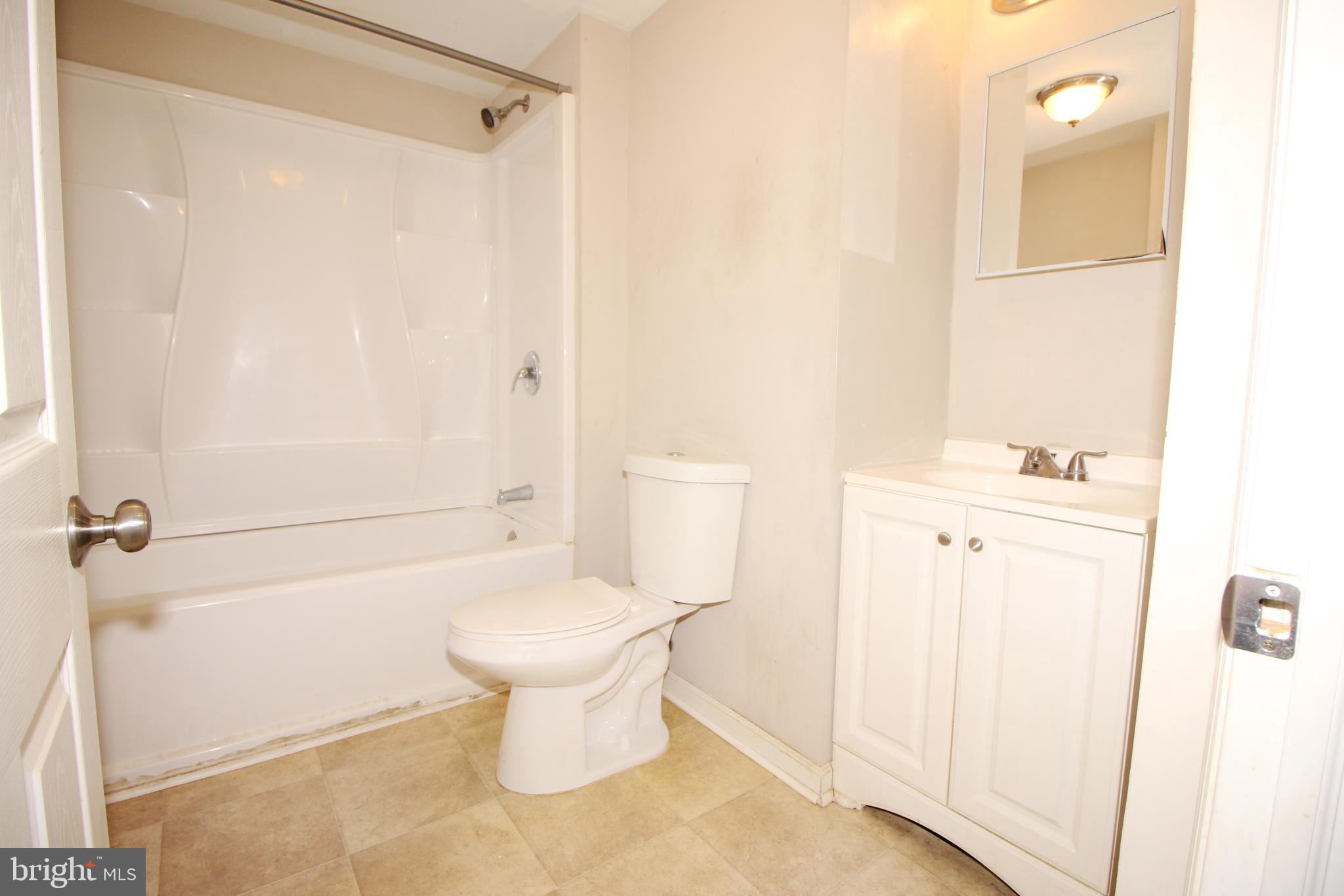 63 Ridgley Street Mount Holly, NJ 08060 - Photo 23 of 30 a bathroom with a sink toilet and shower