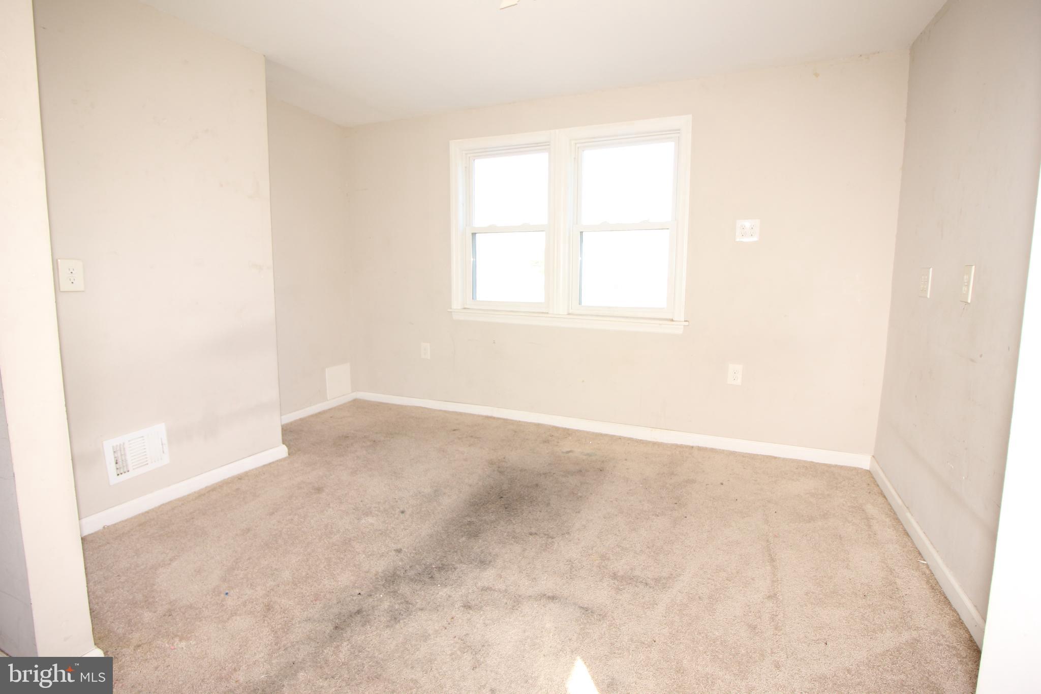 63 Ridgley Street Mount Holly, NJ 08060 - Photo 24 of 30 an empty room with a window