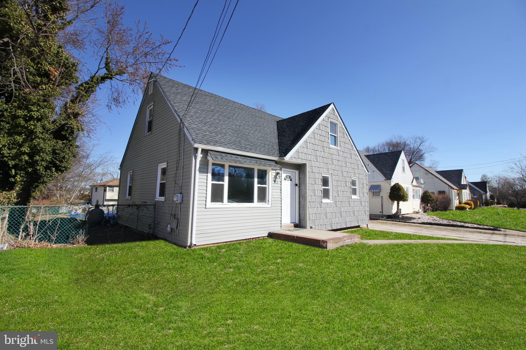63 Ridgley Street Mount Holly, NJ 08060 - Photo 4 of 30 a front view of house with yard and green space