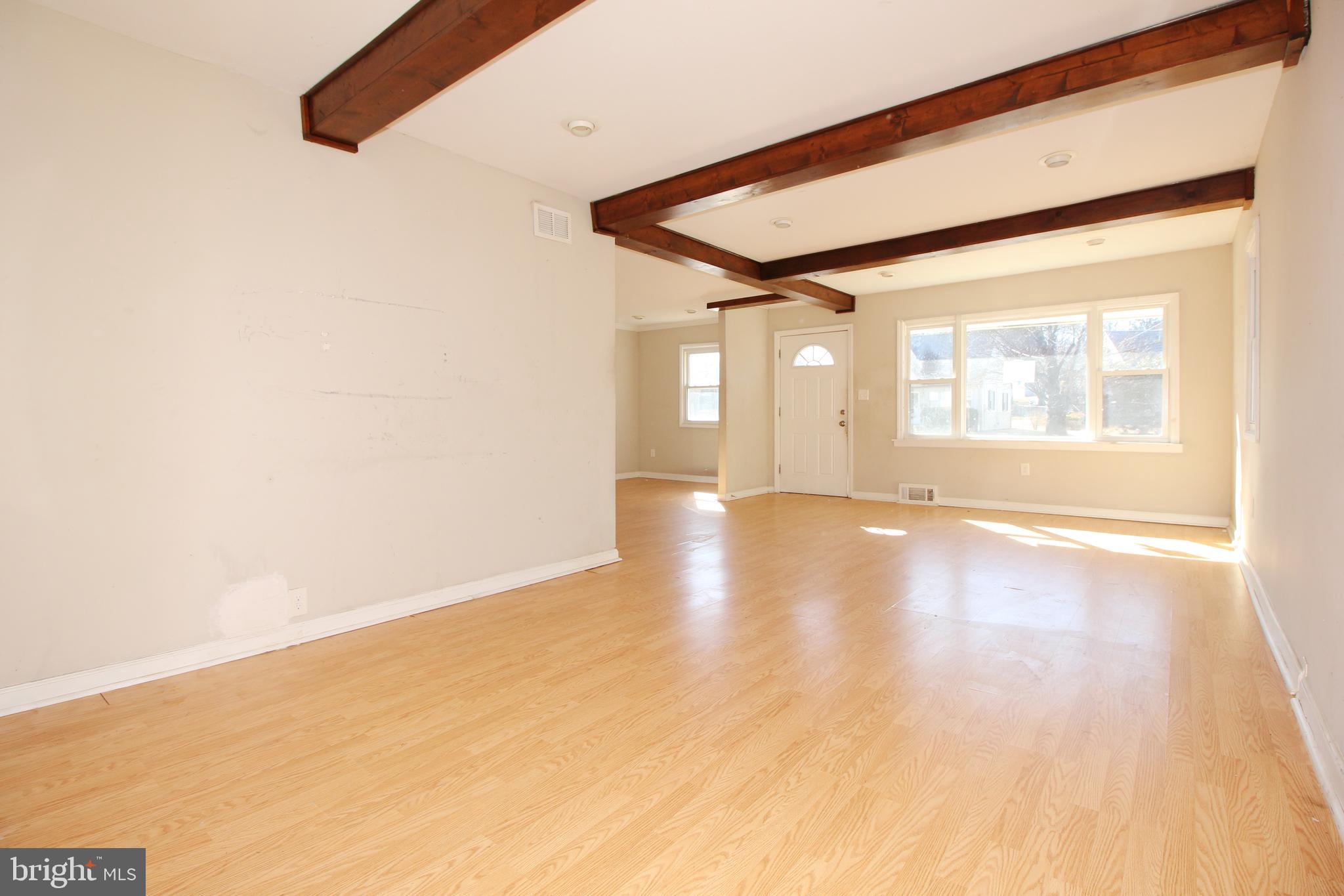 63 Ridgley Street Mount Holly, NJ 08060 - Photo 5 of 30 a view of an empty room with a window
