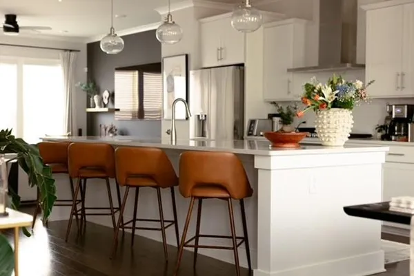a kitchen with a table and chairs in it