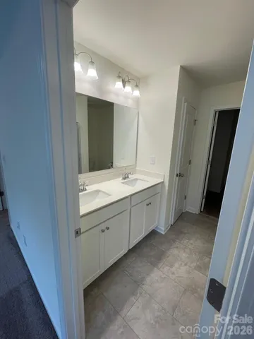 a bathroom with a glass door shower
