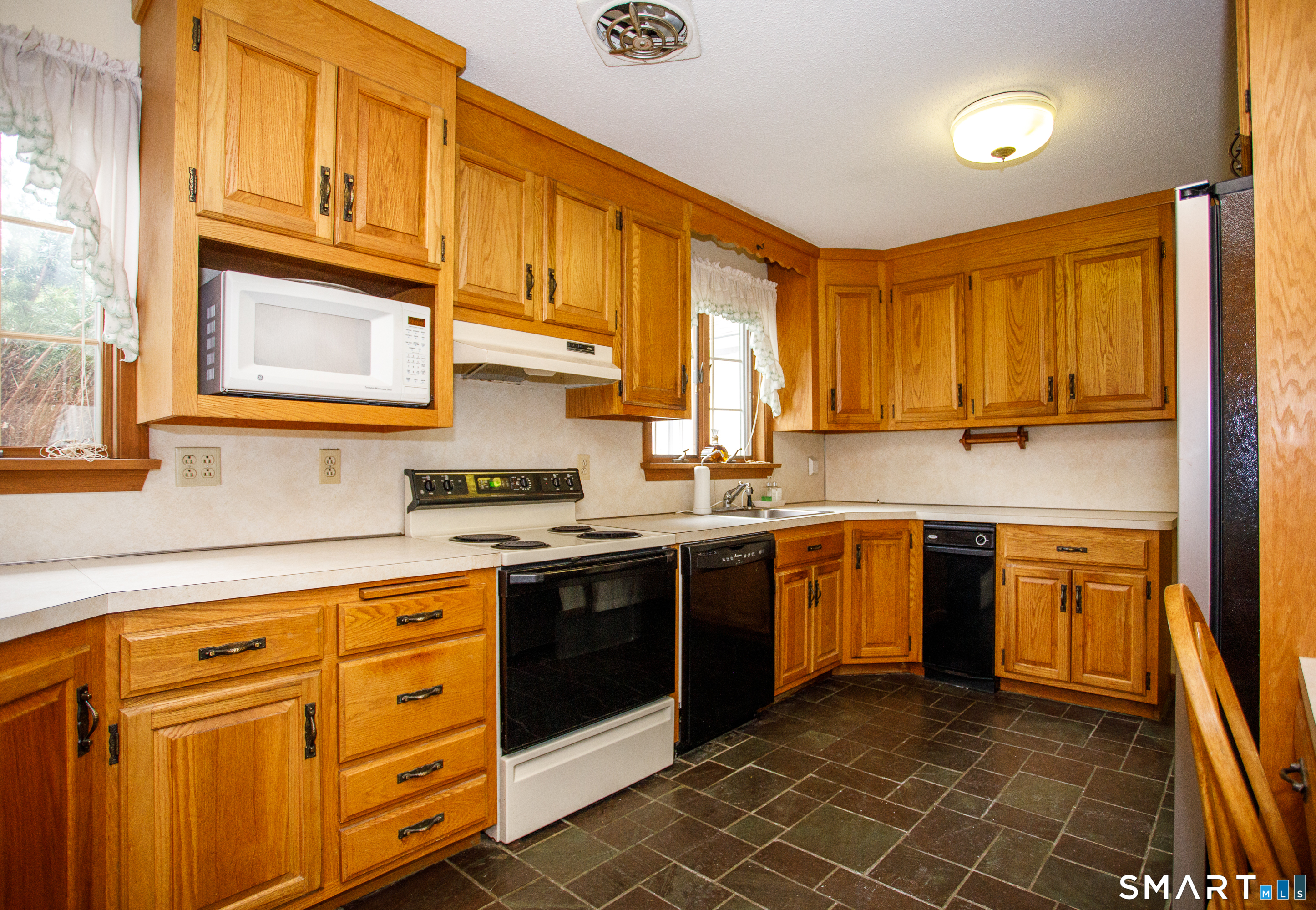 164 Harland Road Norwich, CT 06360 - Photo 13 of 29 a kitchen with stainless steel appliances granite countertop a sink and cabinets