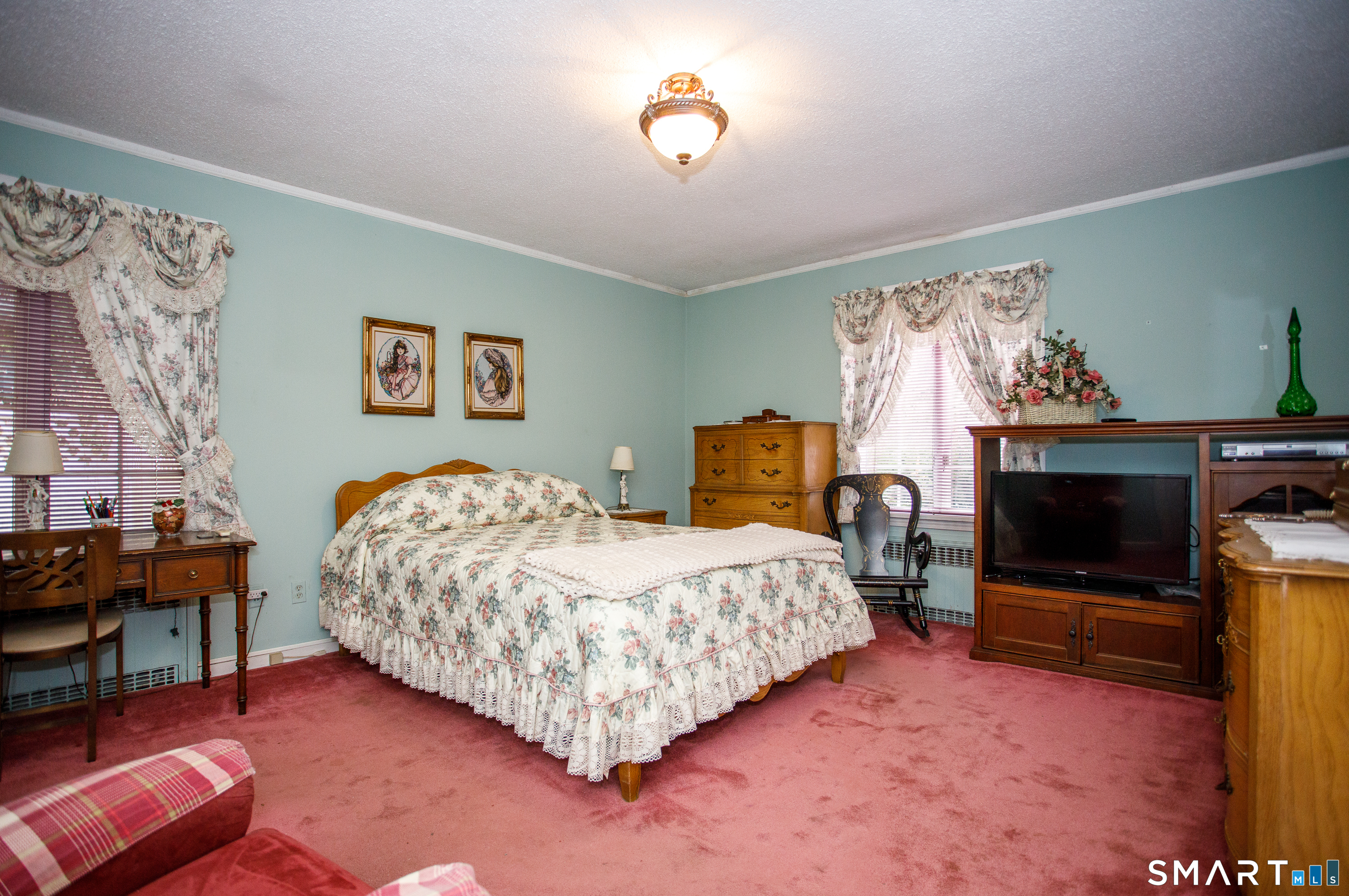 164 Harland Road Norwich, CT 06360 - Photo 17 of 29 a bedroom with a bed and a flat screen tv