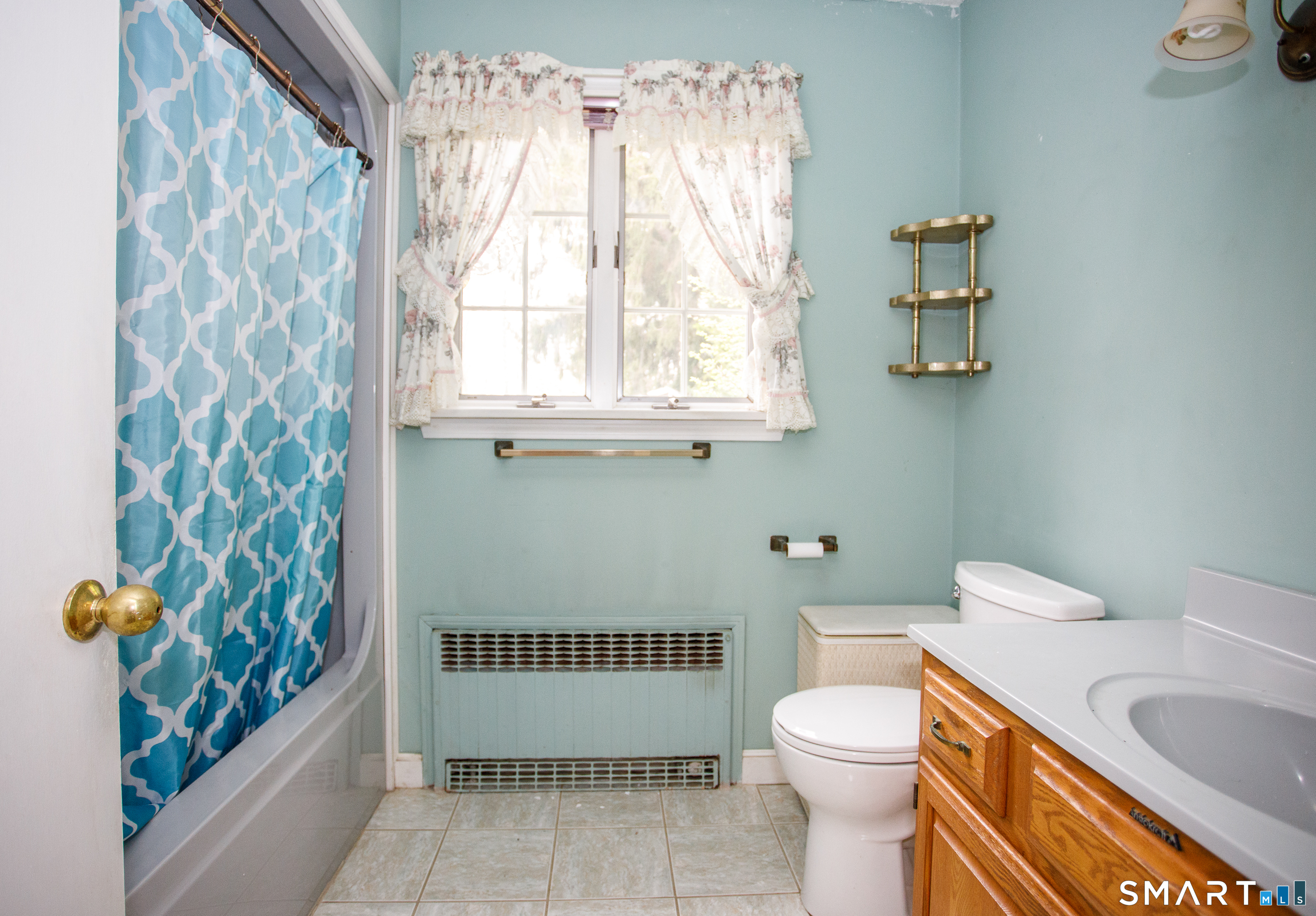164 Harland Road Norwich, CT 06360 - Photo 19 of 29 a bathroom with a sink a toilet and a shower curtain