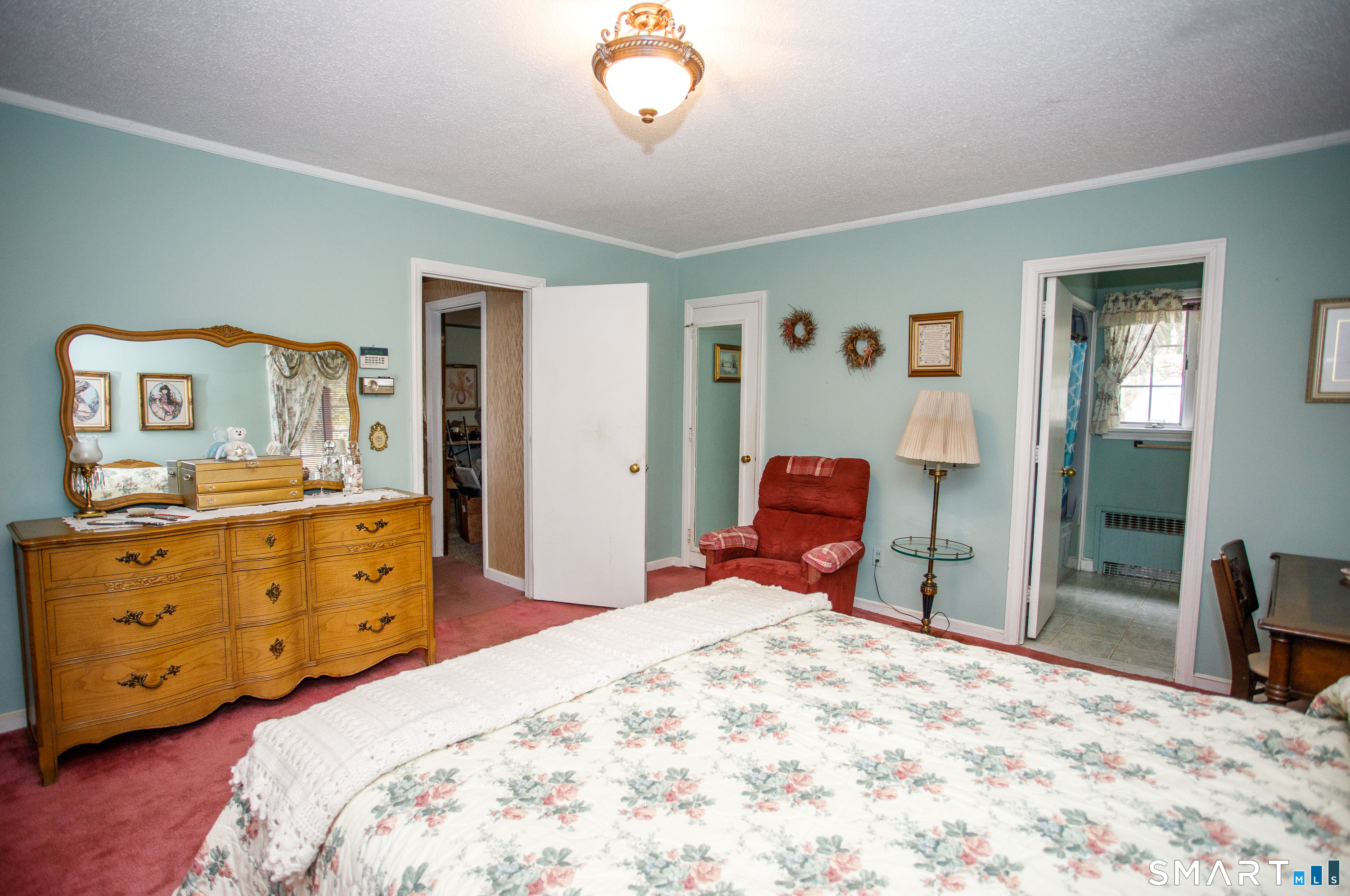 164 Harland Road Norwich, CT 06360 - Photo 20 of 29 a bedroom with a bed and wooden floor