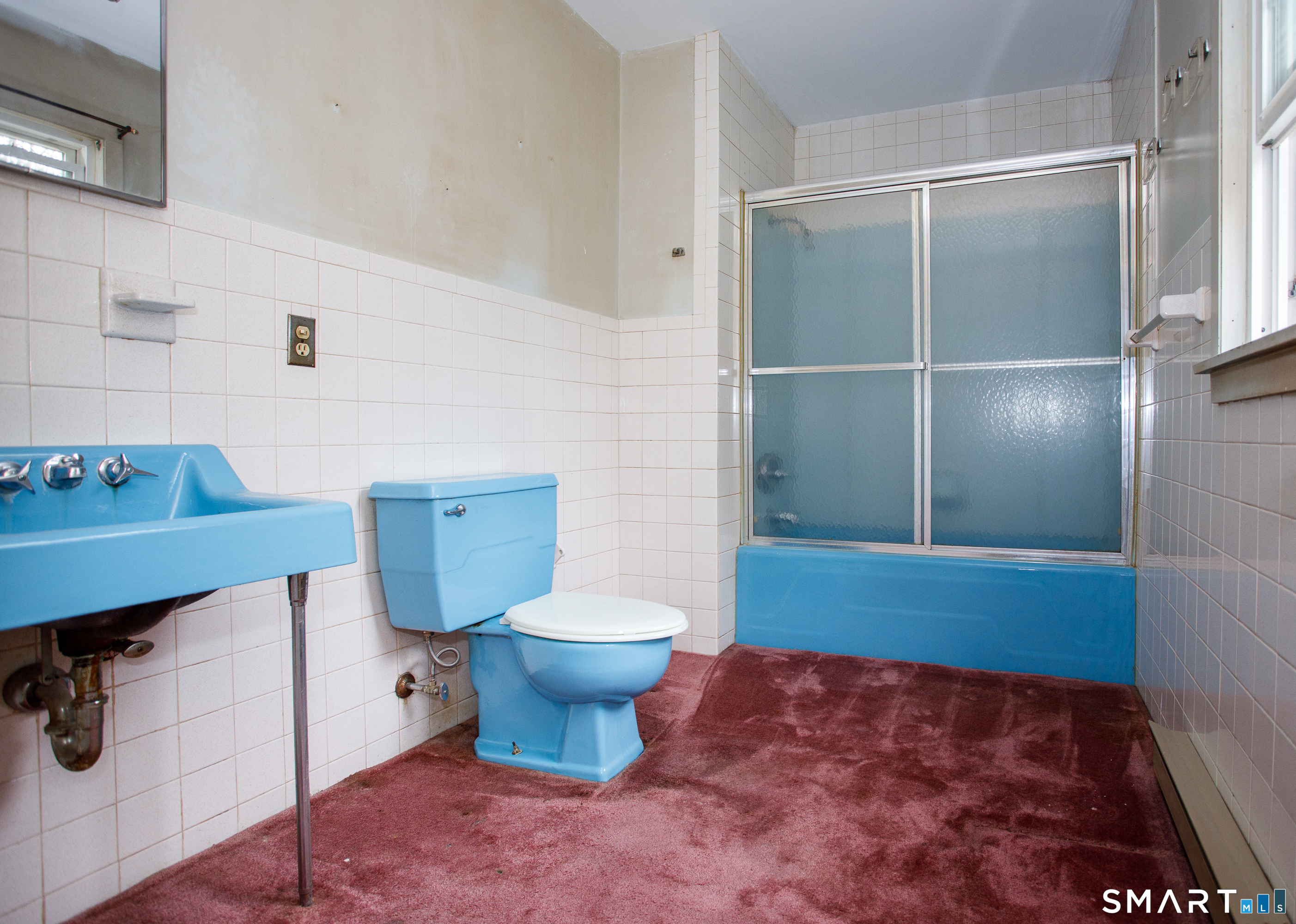 164 Harland Road Norwich, CT 06360 - Photo 26 of 29 a bathroom with a sink toilet and mirror