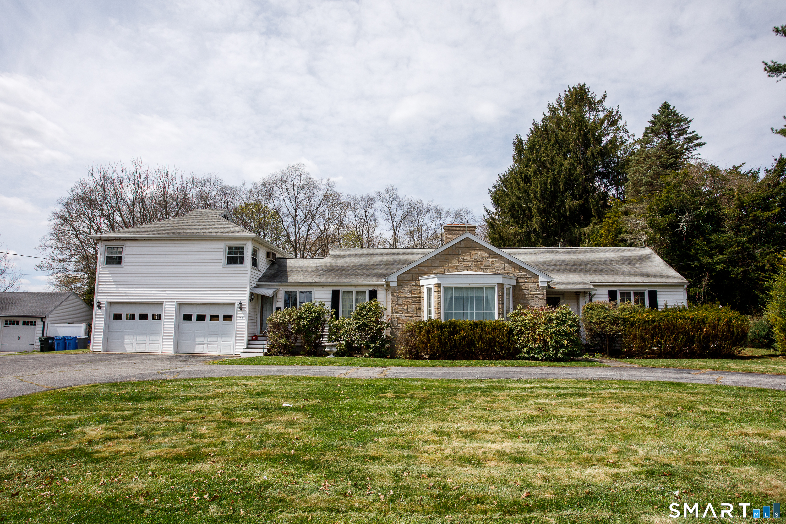 164 Harland Road Norwich, CT 06360 - Photo 29 of 29 a front view of a house with a garden and plants