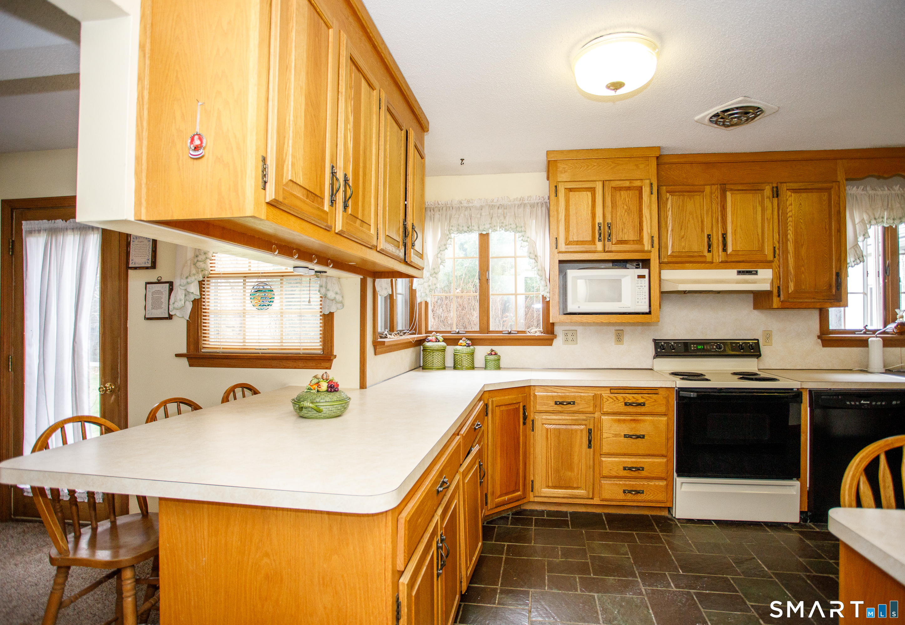 164 Harland Road Norwich, CT 06360 - Photo 10 of 29 a kitchen with a sink a stove and cabinets