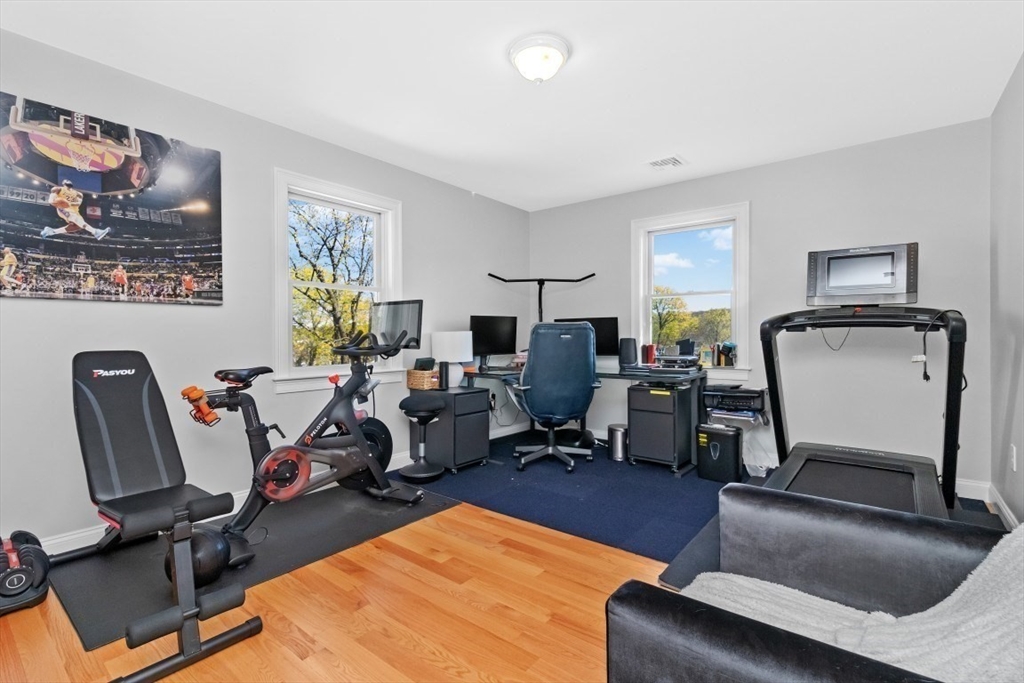 20 College Farm Road Waltham, MA 02451 - Photo 19 of 32 a view of a livingroom with workspace and a couch