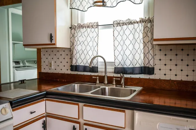 wooden floor in an empty room with a window and wooden floor
