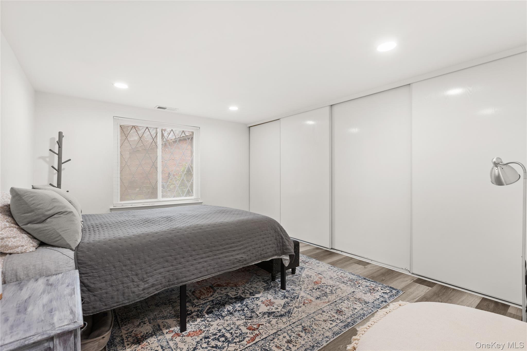 87 Birchwood Road Medford, NY 11763 - Photo 11 of 21 Bedroom featuring wood finished floors and recessed lighting