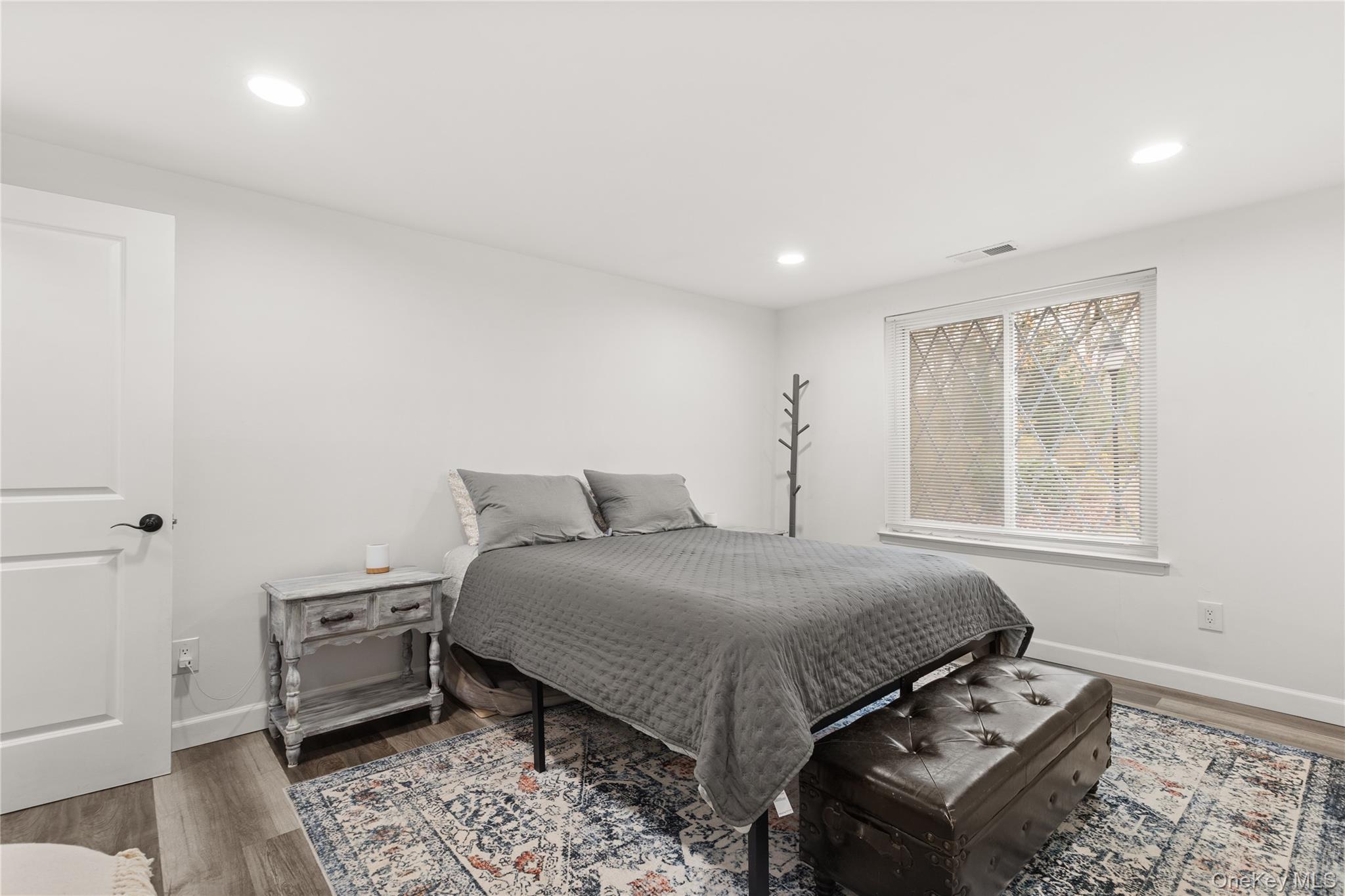 87 Birchwood Road Medford, NY 11763 - Photo 12 of 21 Bedroom with wood finished floors and recessed lighting