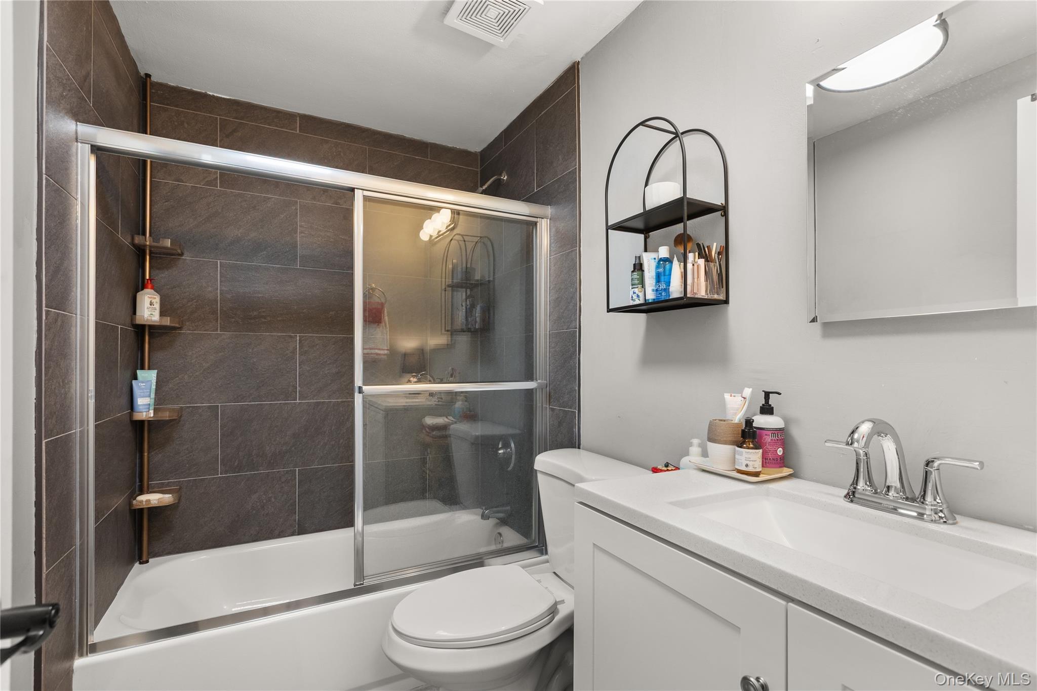 87 Birchwood Road Medford, NY 11763 - Photo 13 of 21 Bathroom featuring enclosed tub / shower combo and vanity