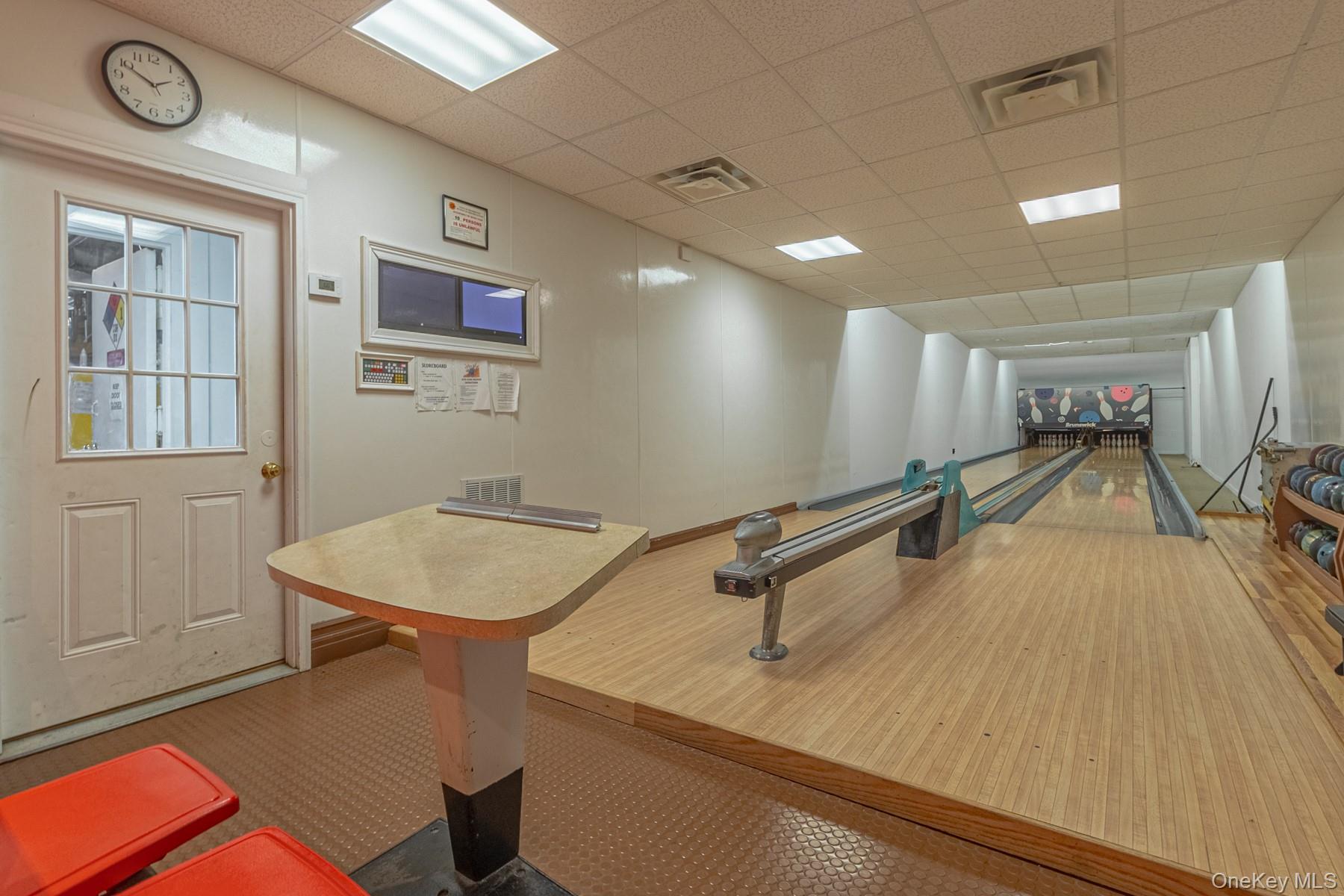 87 Birchwood Road Medford, NY 11763 - Photo 16 of 21 Rec room featuring a paneled ceiling and a bowling alley