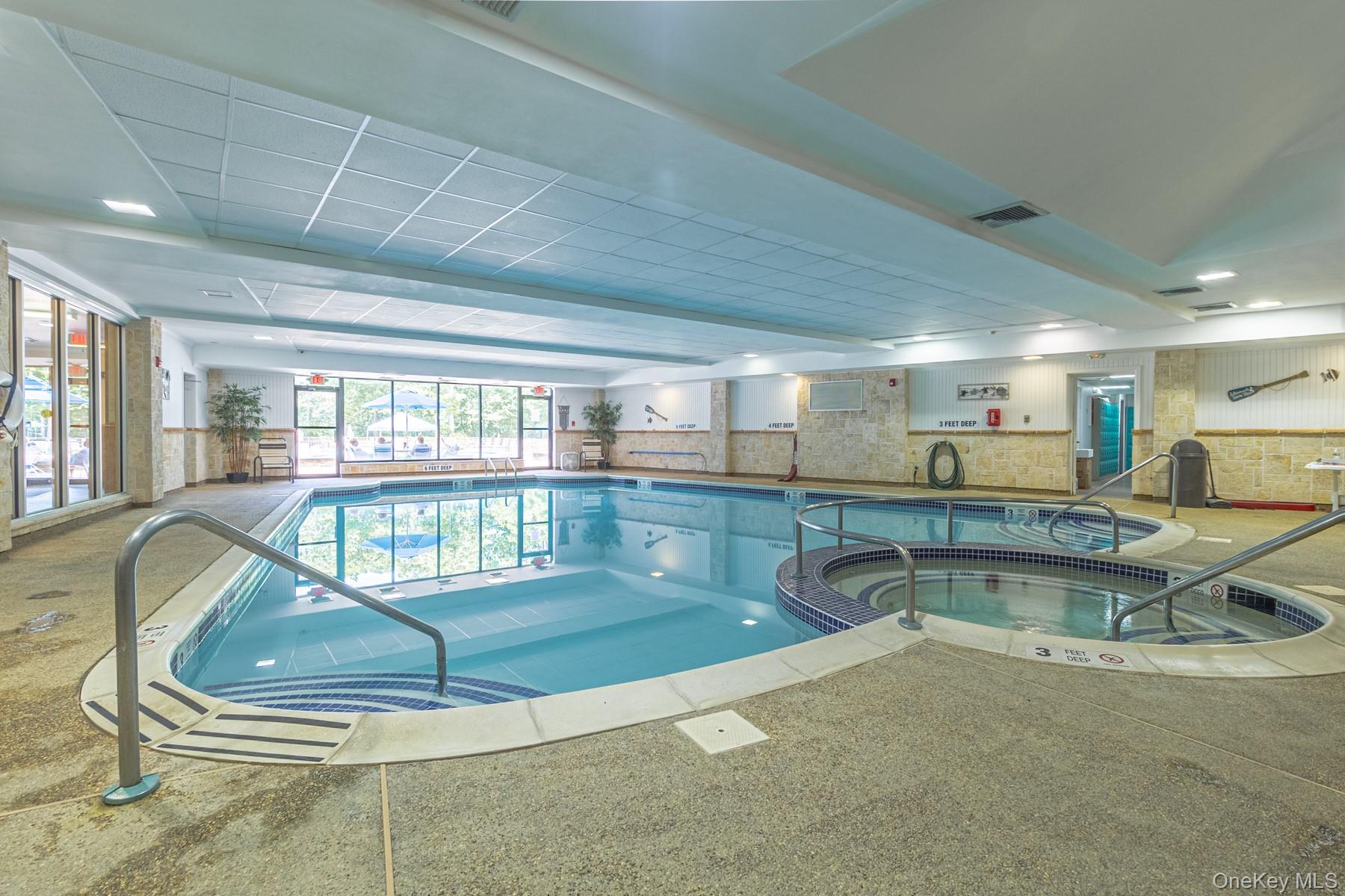 87 Birchwood Road Medford, NY 11763 - Photo 17 of 21 View of swimming pool featuring a pool with connected hot tub