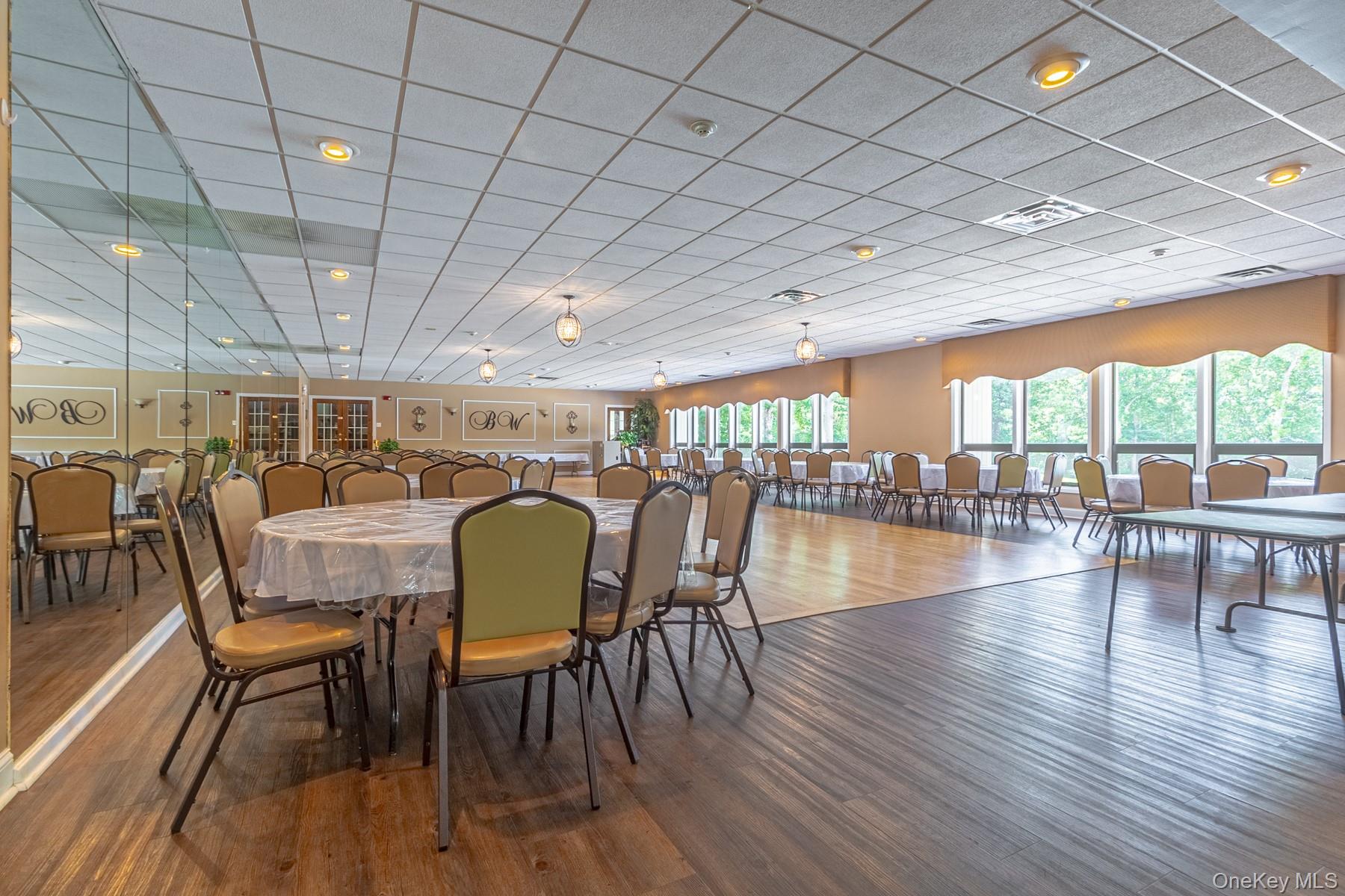 87 Birchwood Road Medford, NY 11763 - Photo 21 of 21 Dining room featuring wood finished floors and a paneled ceiling