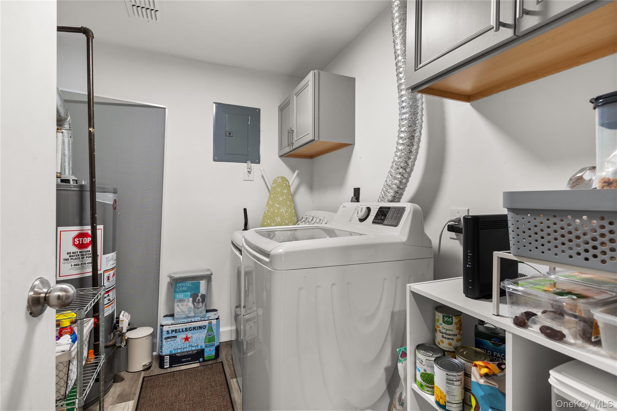 87 Birchwood Road Medford, NY 11763 - Photo 10 of 21 Washroom with electric panel, independent washer and dryer, gas water heater, and cabinet space