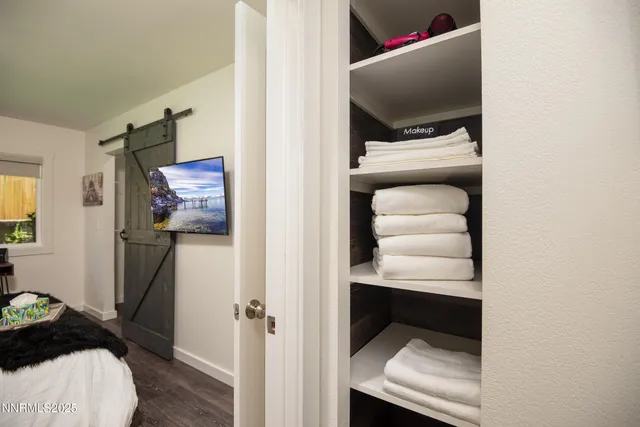 a room with a bench and a hallway