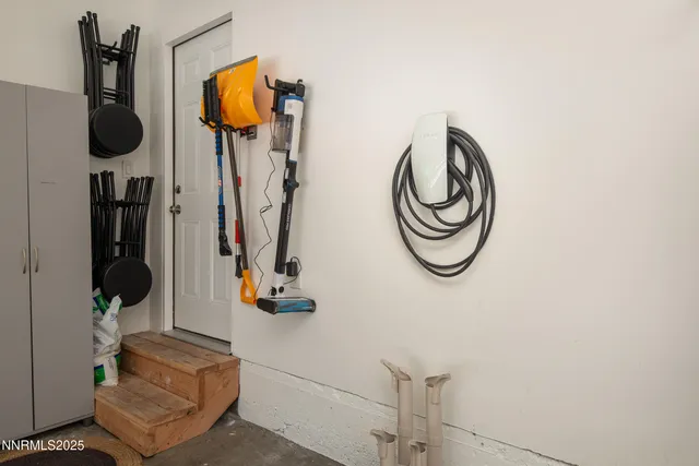 a view of a patio with table and chairs and potted plants