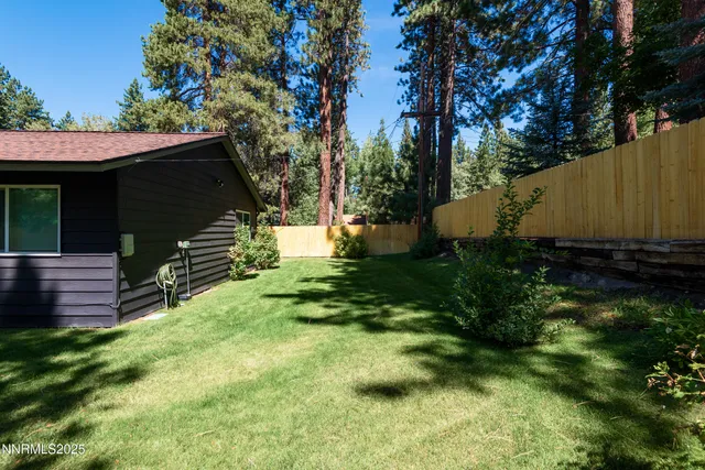 a backyard of a house with lots of green space