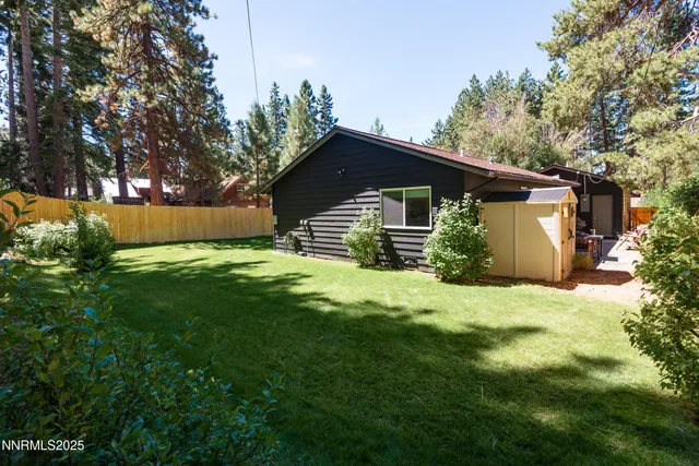 a view of a lush green hillside and a houses