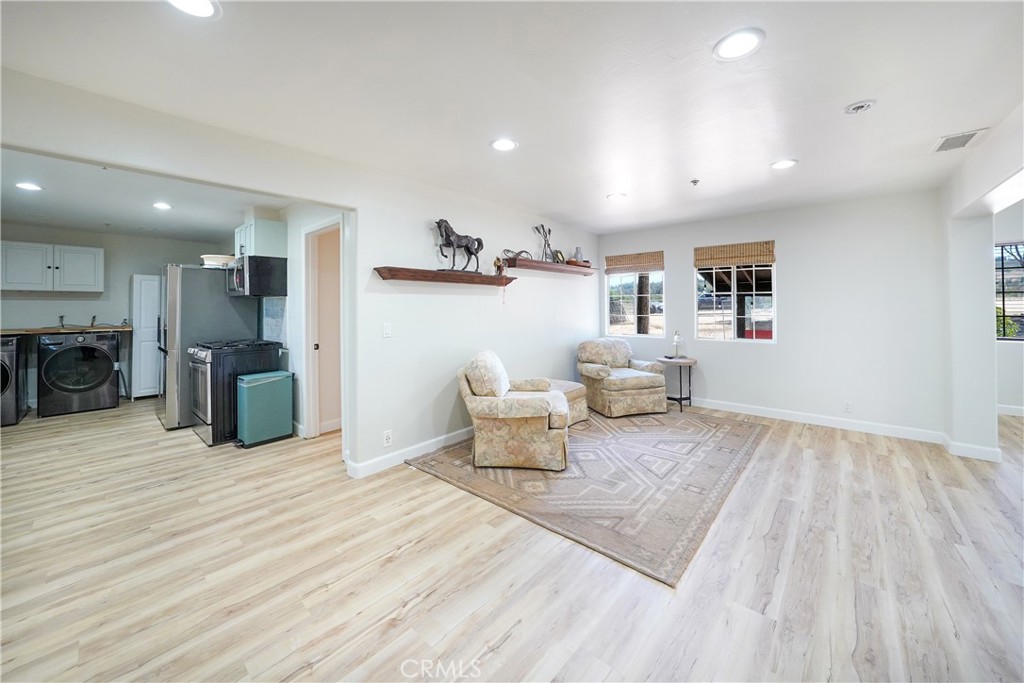 2165 Lilac Road Ramona, CA 92065 - Photo 14 of 49 a living room with furniture and a wooden floor