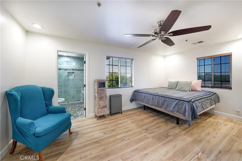 2165 Lilac Road Ramona, CA 92065 - Photo 16 of 49 a bedroom with a bed couch and window