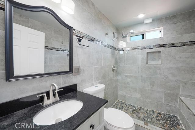 2165 Lilac Road Ramona, CA 92065 - Photo 18 of 49 a bathroom with a sink toilet a mirror and shower