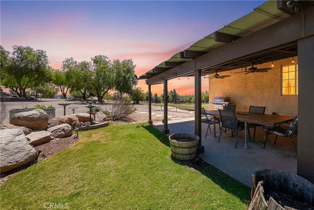 2165 Lilac Road Ramona, CA 92065 - Photo 23 of 49 a view of a swimming pool with lawn chairs and couches