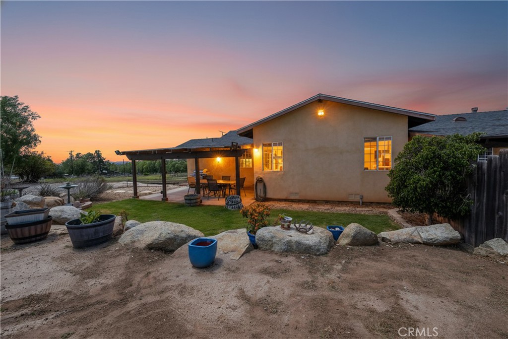 2165 Lilac Road Ramona, CA 92065 - Photo 24 of 49 a view of a backyard with plants and a patio