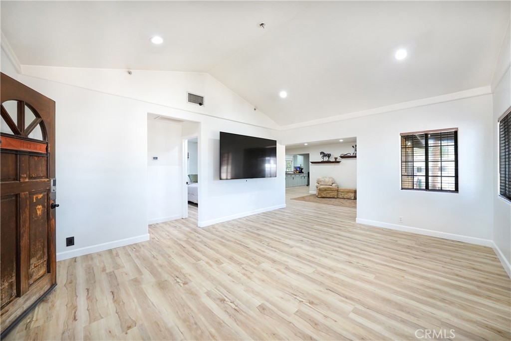 2165 Lilac Road Ramona, CA 92065 - Photo 10 of 49 a view of a livingroom with wooden floor and a flat screen tv