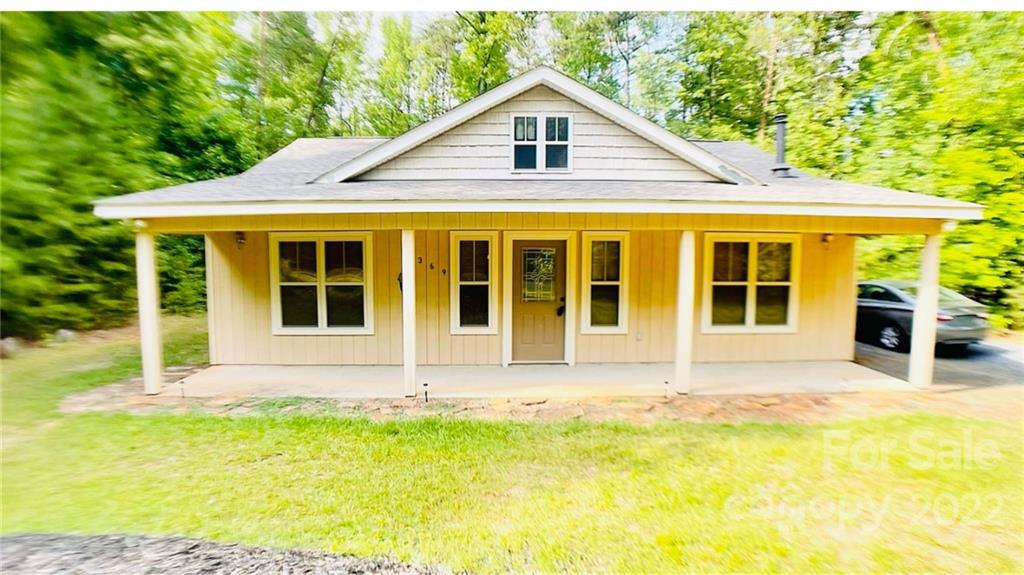 369 Pinecrest Circle Troy, NC 27371 - Photo 1 of 6 a house with a yard