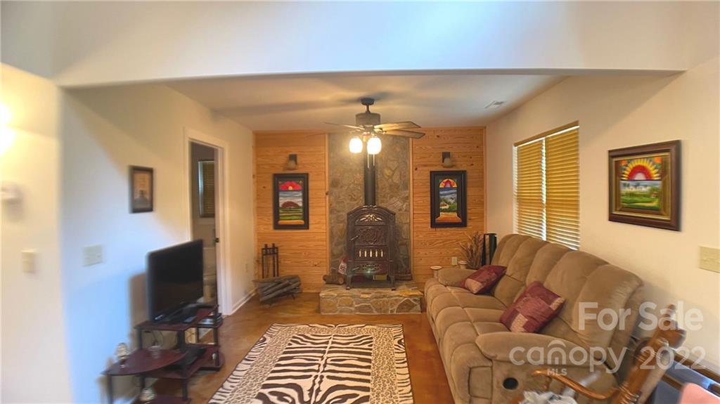369 Pinecrest Circle Troy, NC 27371 - Photo 6 of 6 a living room with furniture and a flat screen tv