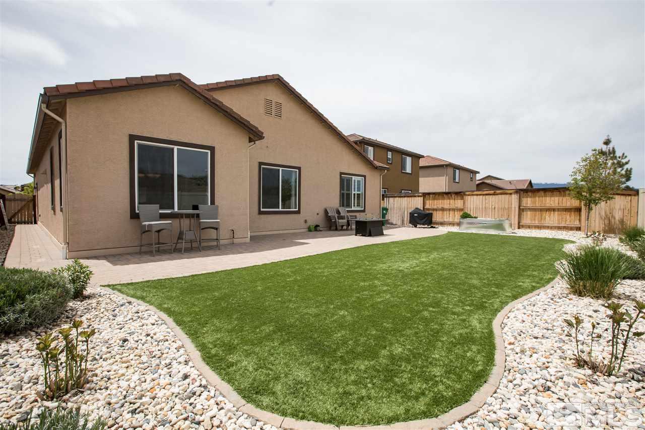 3045 Show Jumper Lane Reno, NV 89521 - Photo 20 of 22 a backyard of a house with table and chairs