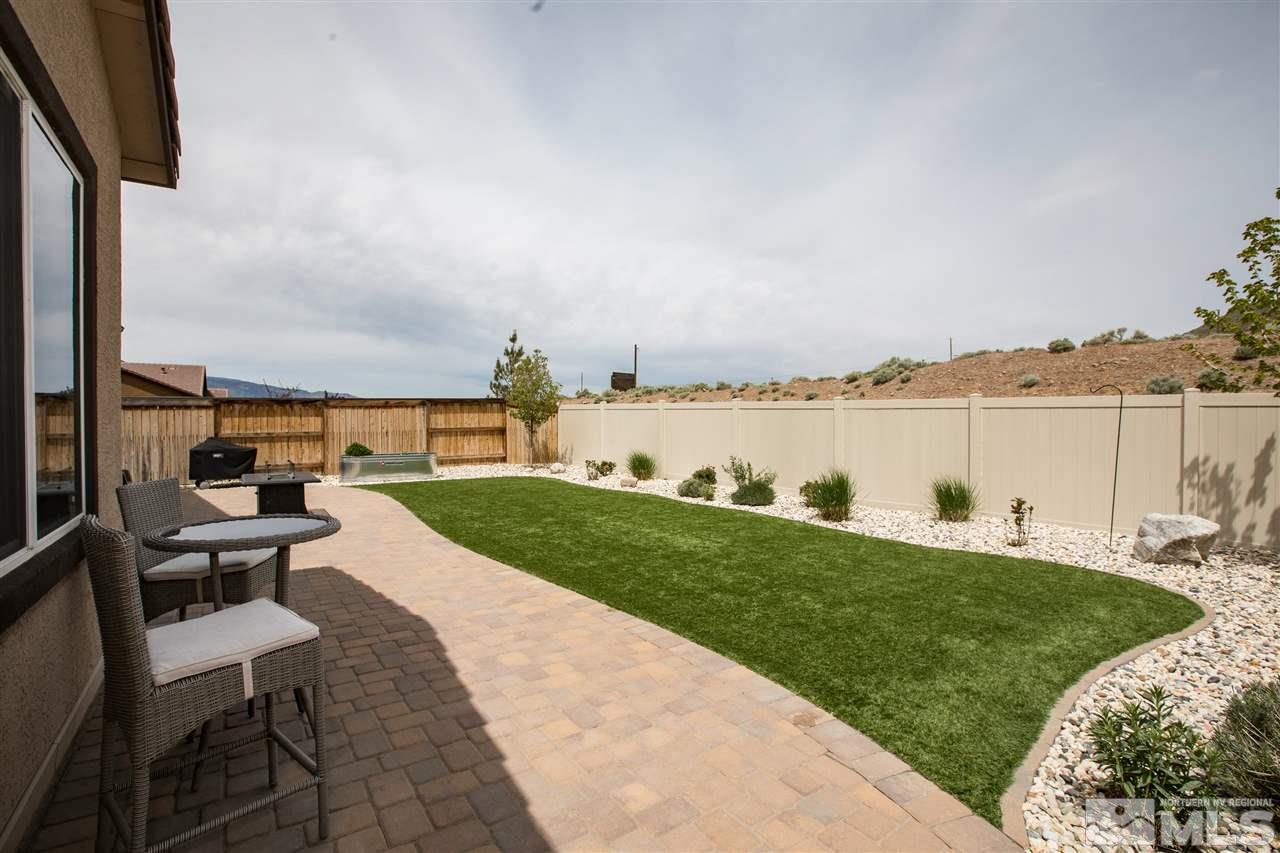 3045 Show Jumper Lane Reno, NV 89521 - Photo 21 of 22 a view of a backyard with sitting area