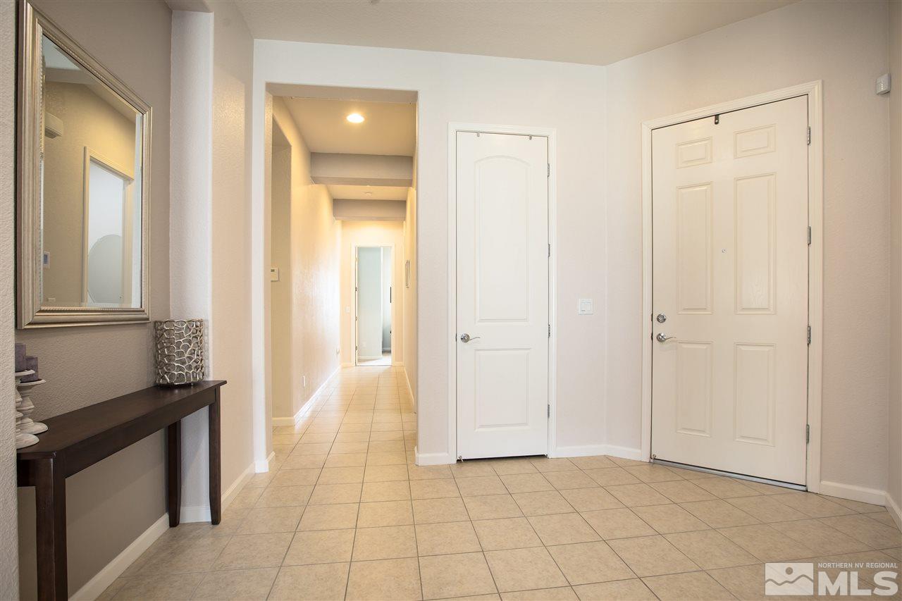 3045 Show Jumper Lane Reno, NV 89521 - Photo 3 of 22 a view of a closet area with living room